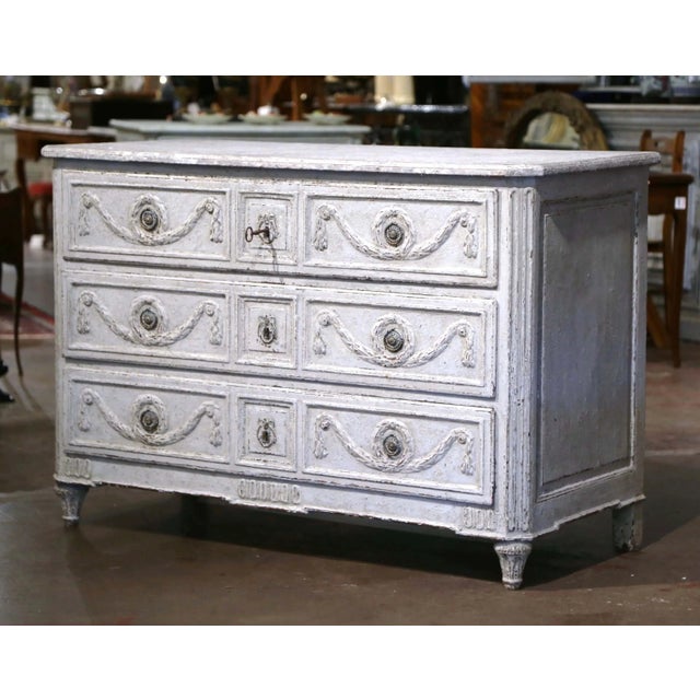 Decorate a bedroom or a living room with this elegant antique chest of drawers. Crafted in France, circa 1780, the cabinet...