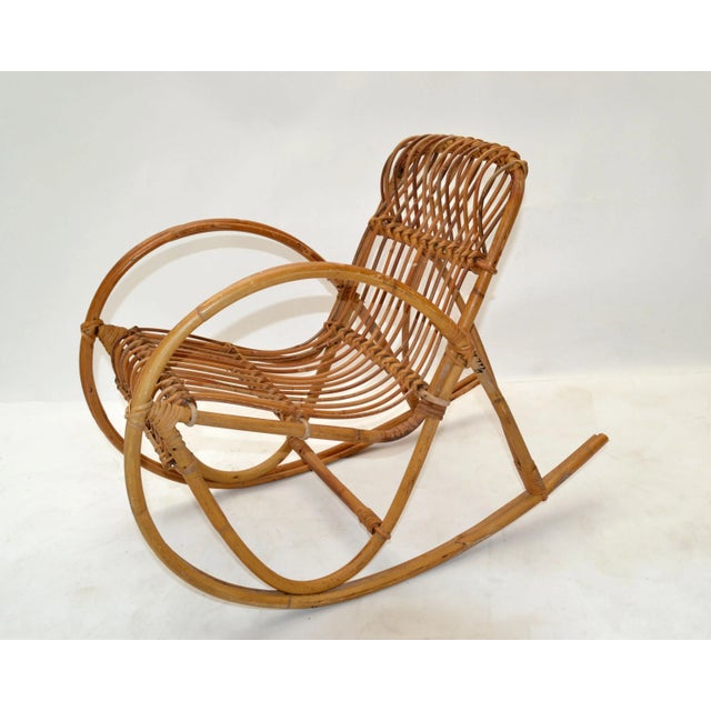 Cute bohemian bamboo and cane seat children rocking armchair. The chair is firm and sturdy, a fun item for your kids....