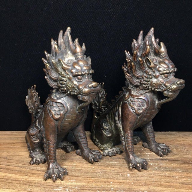 Enhance your space with this striking pair of vintage-style bronze mythical beast statues. Traditionally known as Xiezhi...