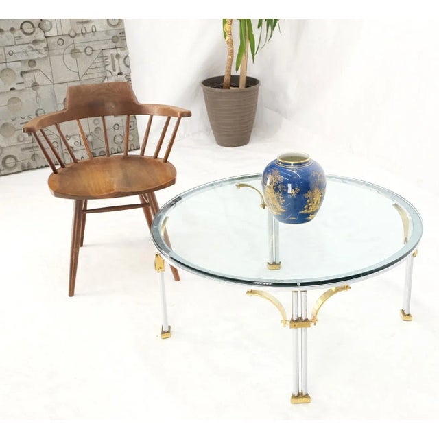 Round glass top chrome legs solid brass stretchers & feet coffee center table.