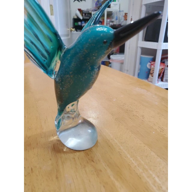 Bring elegance and vibrant color to your décor with this stunning GCA Art Glass flying hummingbird figurine. Expertly...