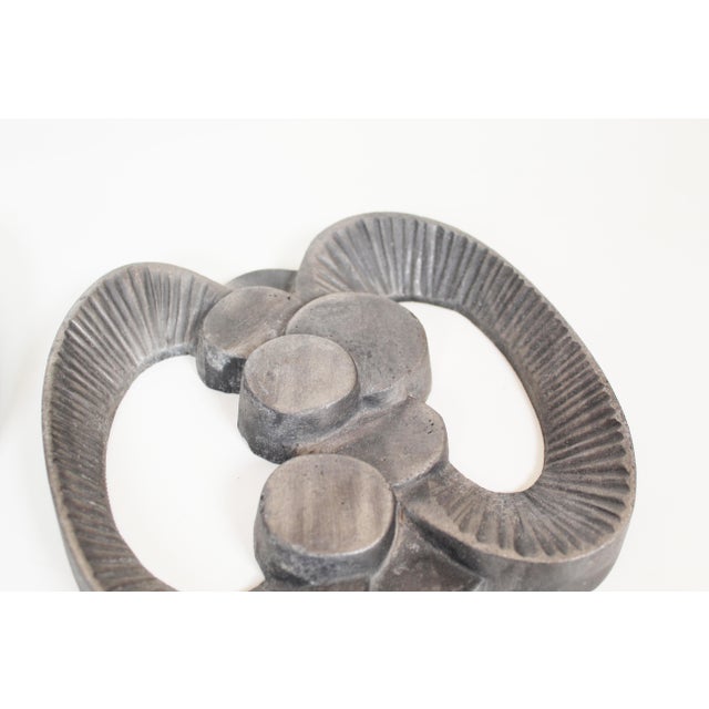 Set of decorative and heavy Brutalist wall ornaments / door handles in cast aluminium. Both in very beautiful condition...