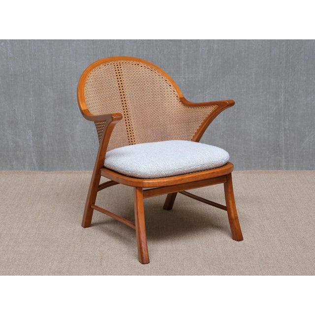 This rare armchair was produced in Denmark in the 1940s, and its striking design is attributed to Frits Schlegel. The...