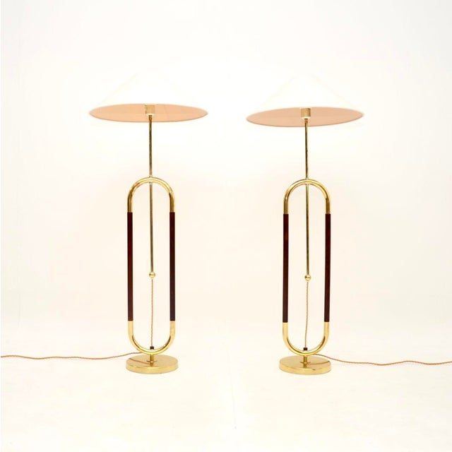 A stunning pair of vintage Swedish brass and birch floor lamps by Bergboms. They were recently imported from Sweden, they...