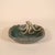 A beautifully handcrafted studio pottery bowl featuring a whimsical sculptural octopus emerging over the rim, its...
