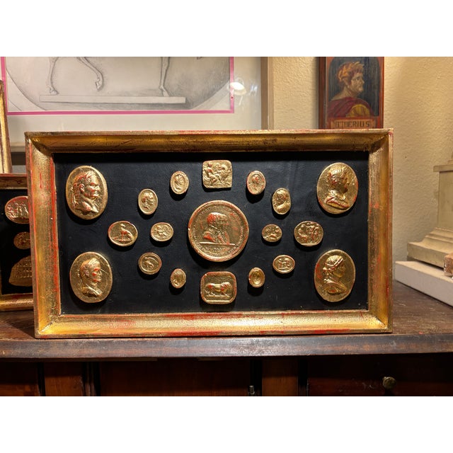 Fine arrangement with classical gilded plaster cameos representing classical characters, emperors and architectural and...