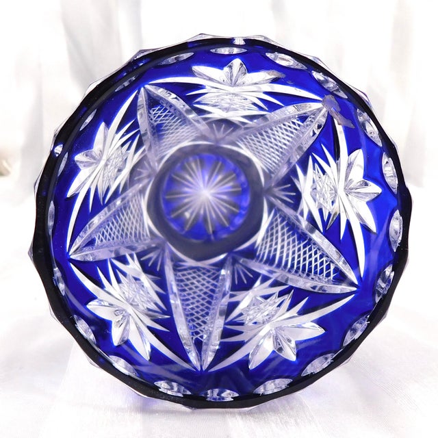 This is a small blue cut to clear vase. It is very heavy for its size and the blue glass is thick and dark with clean...