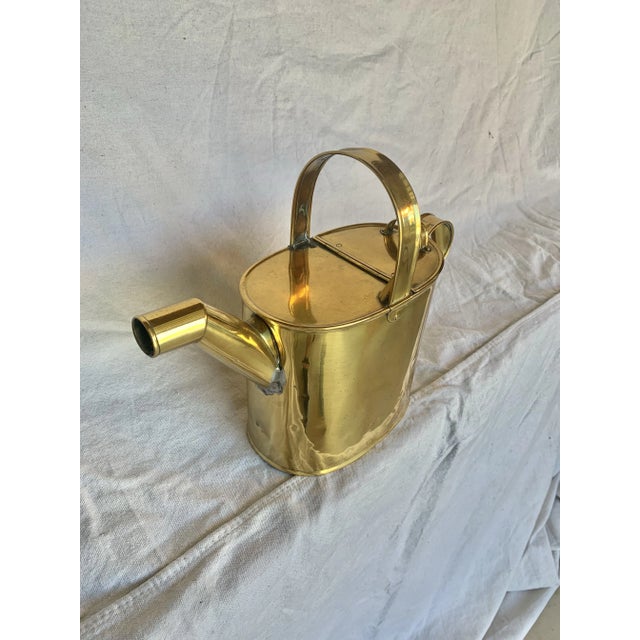 Found in England, this Early 20th Century Garden Watering Can was crafted by artisans from brass in the early 1900's. The...