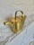 Found in England, this Early 20th Century Garden Watering Can was crafted by artisans from brass in the early 1900's. The...