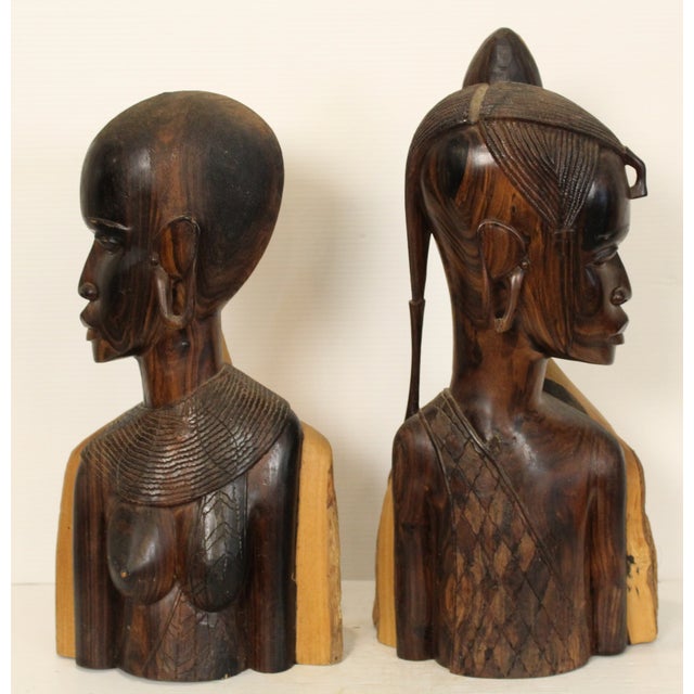 A stunning pair of hand sculpted Maasai Kenyan warriors, made from sold two tone ebony wood. Each bust has distinctive...