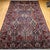 This exquisite vintage oversized Persian Bakhtiari rug showcases a stunning allover floral vase panel design, handwoven in...