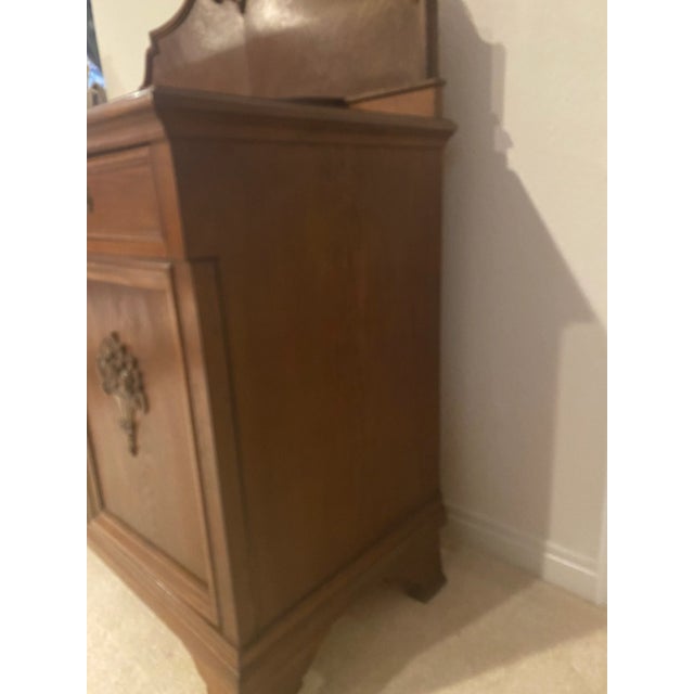 An exquisite heirloom Black Forest style carved oak European mid 20th century buffet/sideboard. Outstanding historic...