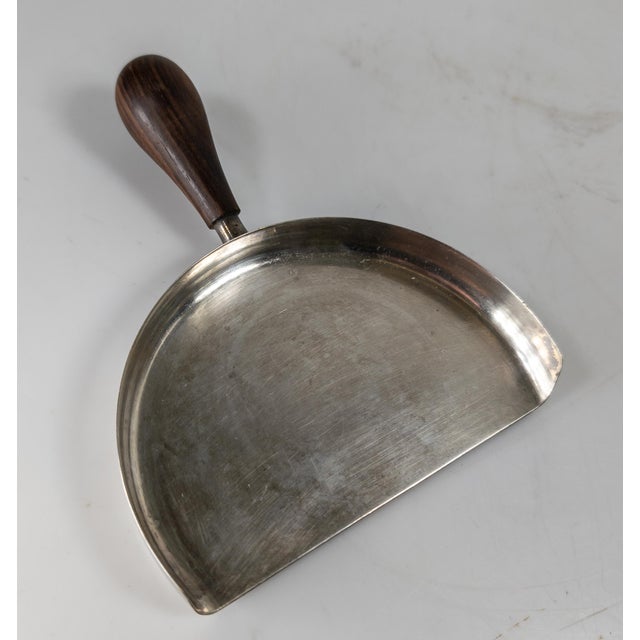 We are selling this nice Mid-Century Modern Italian silverplate crumber or silent butler. The piece has great form with...