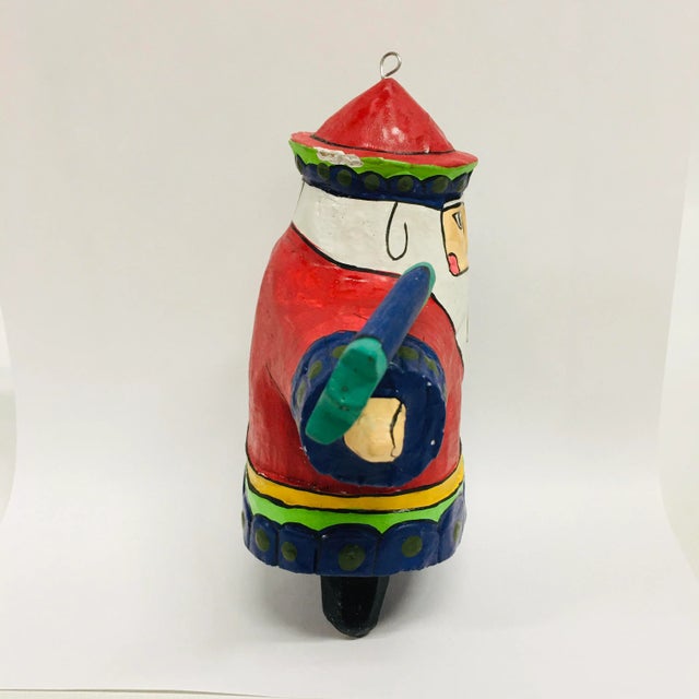 Folk Art Painted Wood Santa with Bird, all features hand painted.