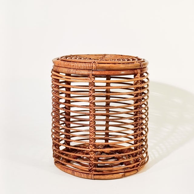 French Riviera style rattan stool or basket by Tito Agnoli, Italy, 1970s. Cylindrical body formed by a curved rattan and...