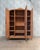 A stunning art deco wardrobe from the 1930s, whose gracefully curved silhouette, magnificent speckled maple veneer, and...