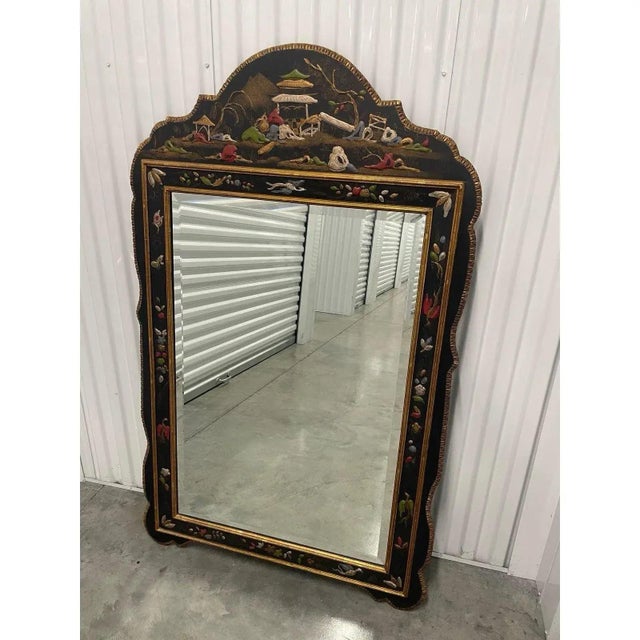 Offered is an exquisite vintage wall mirror. This piece features a heavy wooden frame with beveled glass and hand-painted...