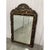 Offered is an exquisite vintage wall mirror. This piece features a heavy wooden frame with beveled glass and hand-painted...