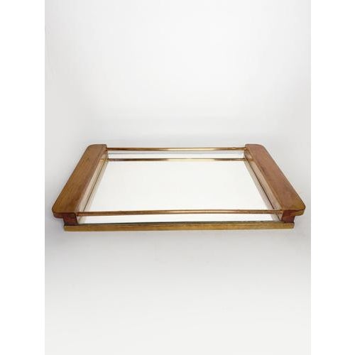 An elegant Art Deco tray dating from the 1940s, combining wood, copper rods, and a mirrored surface. The clean lines of...