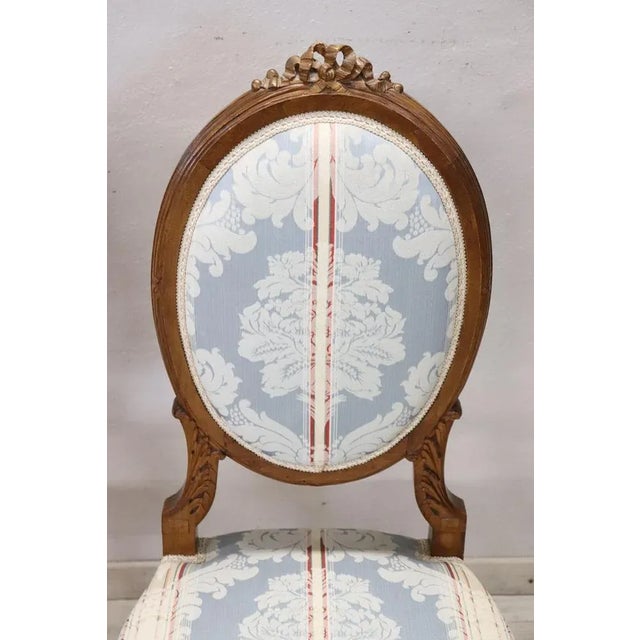 Refined italian Louis XVI style chairs, set of two. The chairs made in solid beech wood. The seat and backrest are...