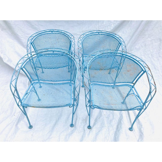 Midcentury set of 4 wrought iron "John Salterini Woodard " Heavy Wrought iron Patio chairs 25"L X 28" H X 27"W They are...