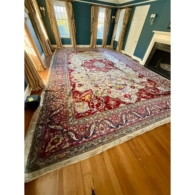 Magnificent oversized Agra medallion hand knotted wool rug in colors of lavender, red, turquoise and pink. From India. The...