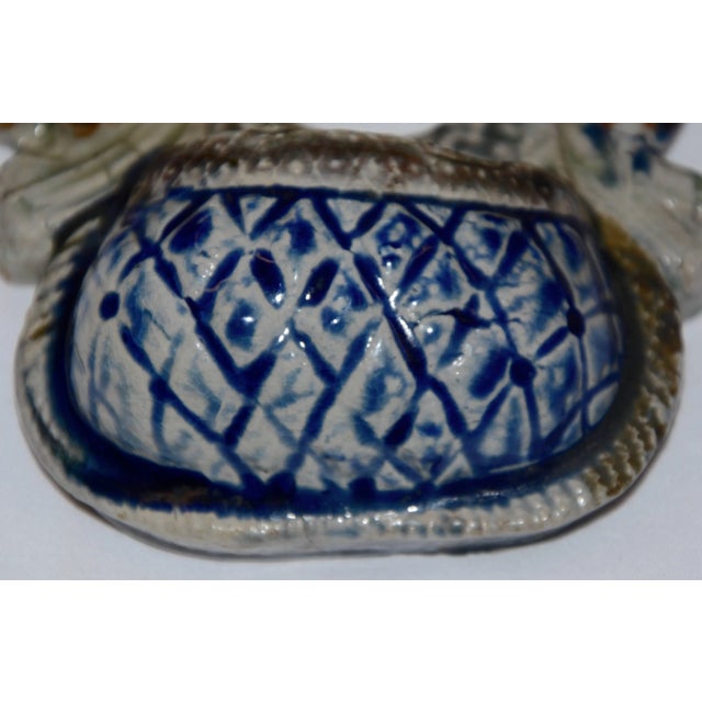 We are offering a unique early 20th century ceramic hunting theme match safe with polychromed enamel decoration. A rabbit...