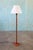 A danish modern solid teak floor lamp featuring a thick solid teak stem. The ruffled linen shade with a nod to Josef...