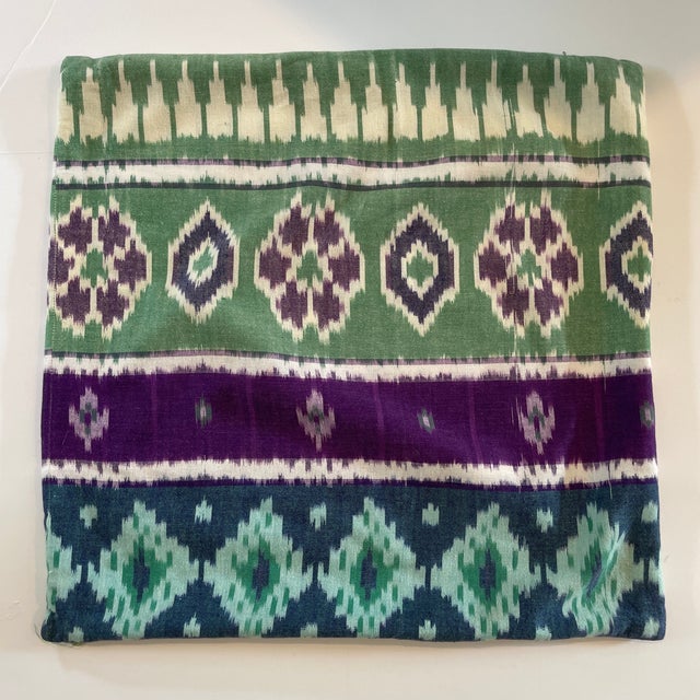 Gorgeous ikat pillow in green and purple tones. Made in India