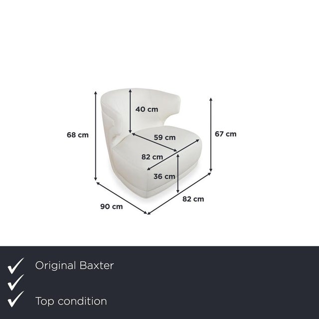 The Baxter Etienne armchair is a masterful example of Italian luxury craftsmanship, blurring the lines between furniture...