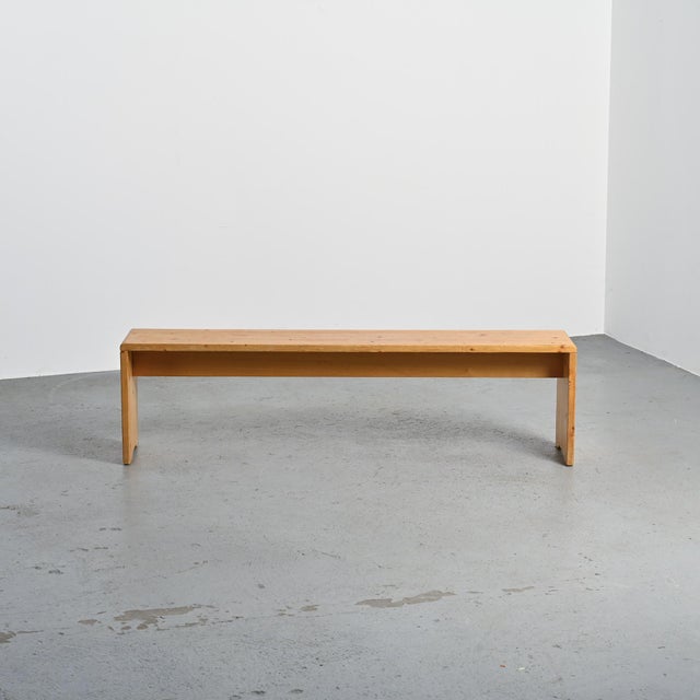 Solid pine bench. Designed in 1969 for the Les Arcs 1800 ski resort. A passionate mountaineer, Charlotte Perriand...