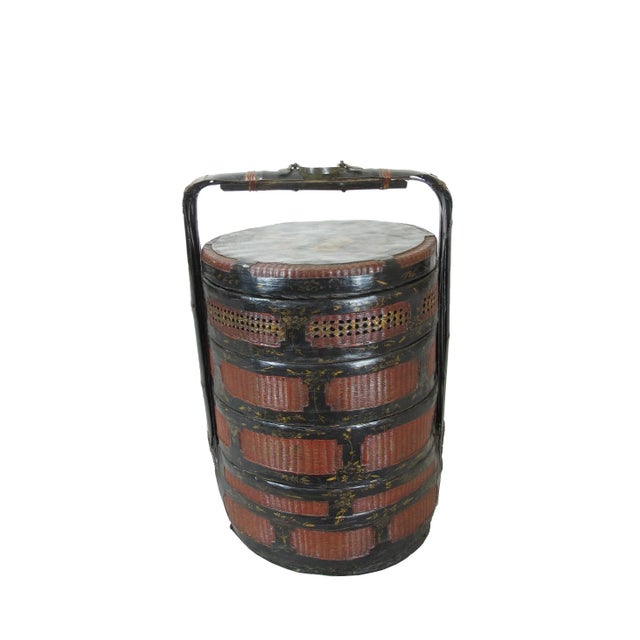 This exotic bamboo food basket was used as a container with 4 separate compartments to transfer the dishes by the owner....