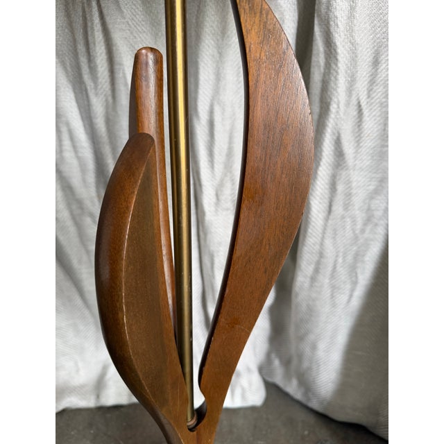 Midcentury Modern Adrian Pearsall style walnut body with sculptural leaf-like silhouette, mounted over a round Carrara...