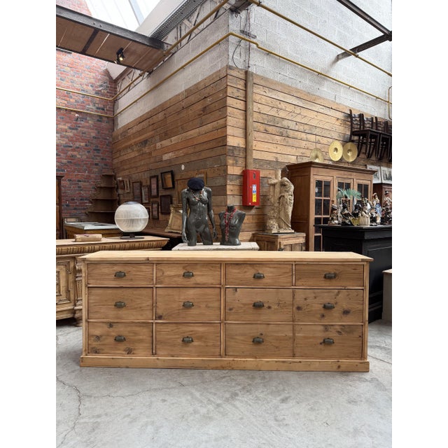 This antique pine cabinet has been fully restored. It features 10 fully functional drawers (including 2 very large ones),...