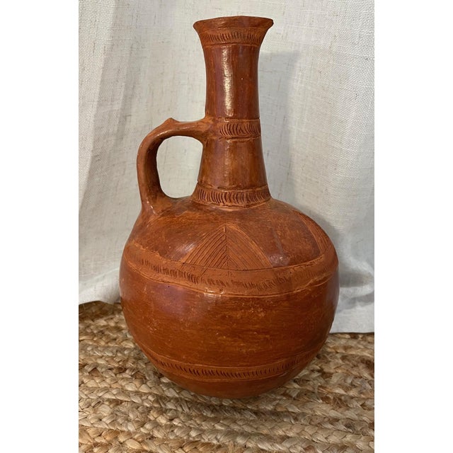 Bring the heart of Ethiopian culture into your home with this authentic, handmade Red Jebena – a traditional clay coffee...