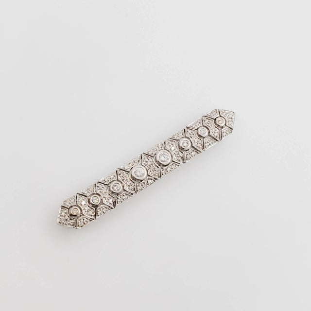Gorgeous estate brooch with 1.50 ct. good quality white diamond rounds. Handmade in 18k white gold. Metal: White Gold...