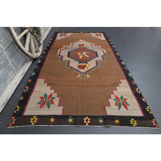 Vintage Turkish Hand-Knotted vintage rug is a semi-antique vintage area rug.'70s Eastern region of Turkey's unique rug is...