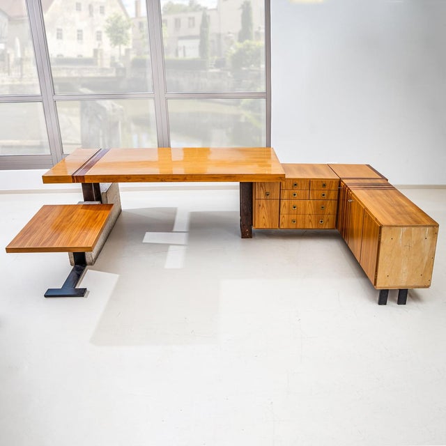 Large U-shaped executive desk with two returns and an extraordinary asymmetrical design. One support is made from cast...