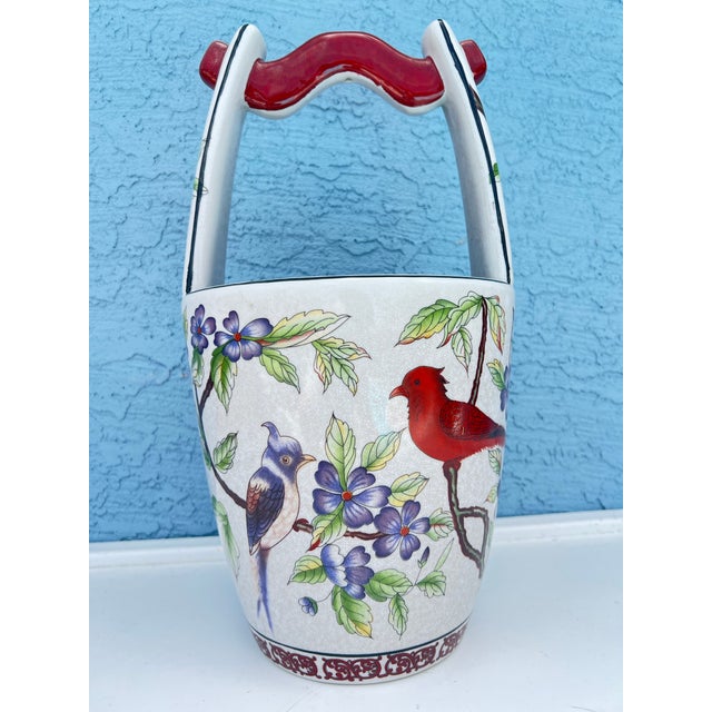 Enhance your home decor with this striking late 20th-century Chinese export ceramic water-well bucket vase. Expertly...