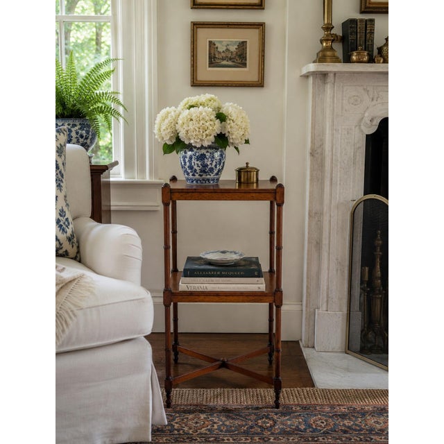 A beautifully proportioned early 20th century two-tier side table by Berkey & Gay, crafted in richly toned mahogany with...