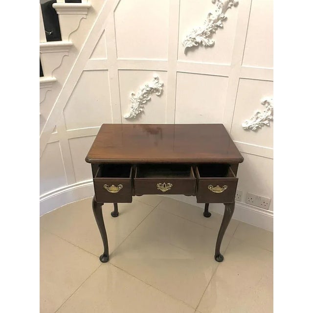 Antique george iii quality figured mahogany lowboy/side table having a quality figured mahogany rectangular shaped top...