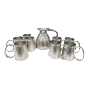 Pewter t.k.f. Banka Tinwerk Indonesian Hammered Art Deco Pewter Pitcher and Eight Tankard Set