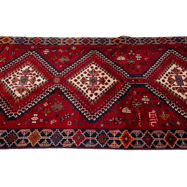 1950s Vintage Persian Hand-Knotted Wool Rug Featuring a Red Field and a Tribal Design For Sale - Image 5 of 10