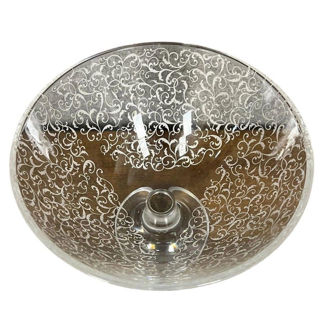 Large Baccarat crystal centerpiece bowl on a pedestal base. Engraved decoration. Label missing from under the base....