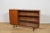 This Mid-Century bookcase in rosewood was produced in Great Britain by Mcintosh in the 1960s. The teak elements have been...