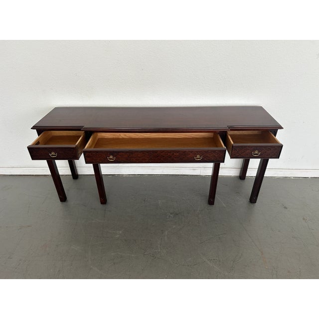Add a touch of timeless elegance to your space with this vintage mahogany console table by Century Furniture. Featuring a...