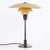 Ph 3½/2½ table lamp designed by poul henningsen and manufactured by louis poulsen in the 1930s. The lamp features a yellow...