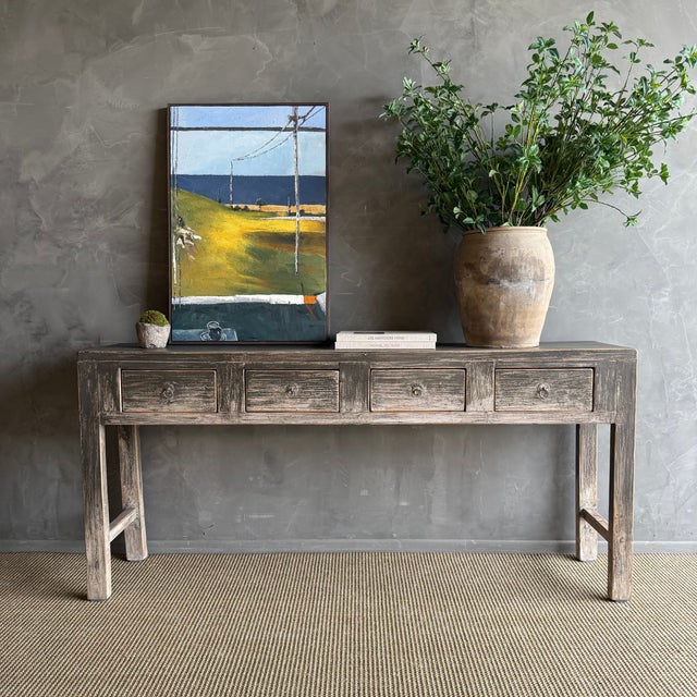 This charming vintage elm wood console is a one-of-a-kind piece with beautiful age and patina that adds character to any...