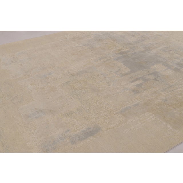 Hand-knotted in a luxurious blend of wool and silk, this 8x11 contemporary abstract rug is the latest addition to Rug &...