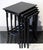 An elegant art nouveau side table set comprising four individual tables of varying sizes that can be nested inside one...